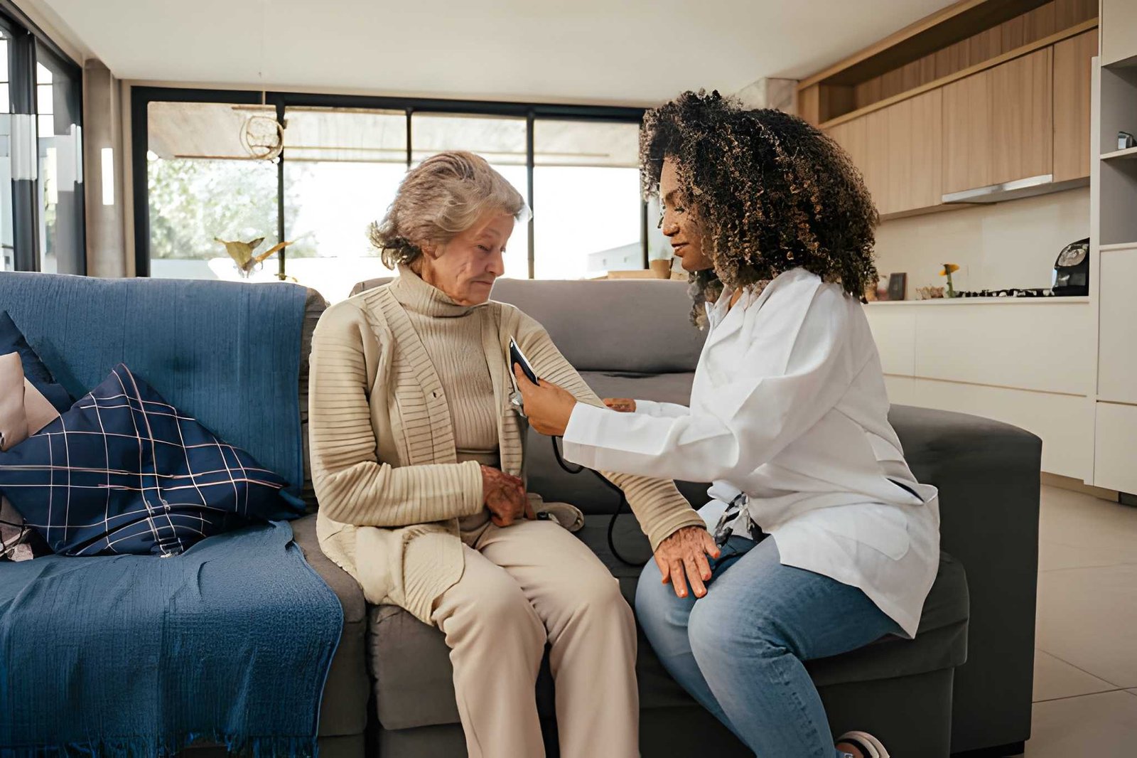 Caregiver embracing elderly woman